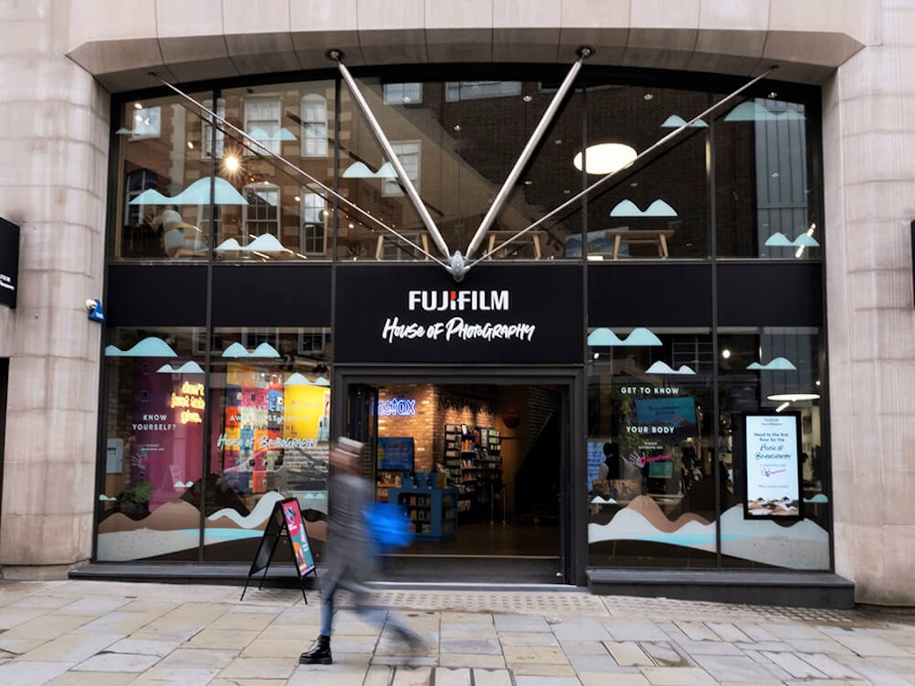 A person walks in front of the FUJIFILM House of Photography in Covent Garden, London