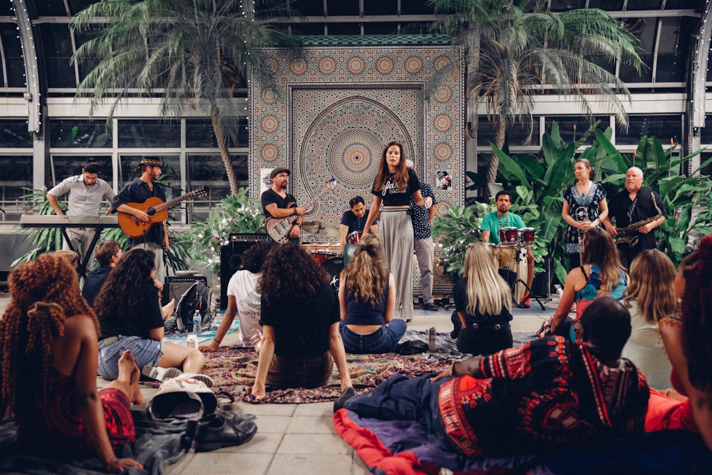 A Sofar MC introduced the next band at Garfield Conservatory in Chicago