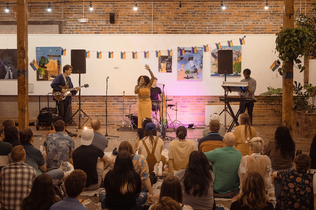 Yasmine Emani performs at Green Spaces in Denver in front of a large crowd