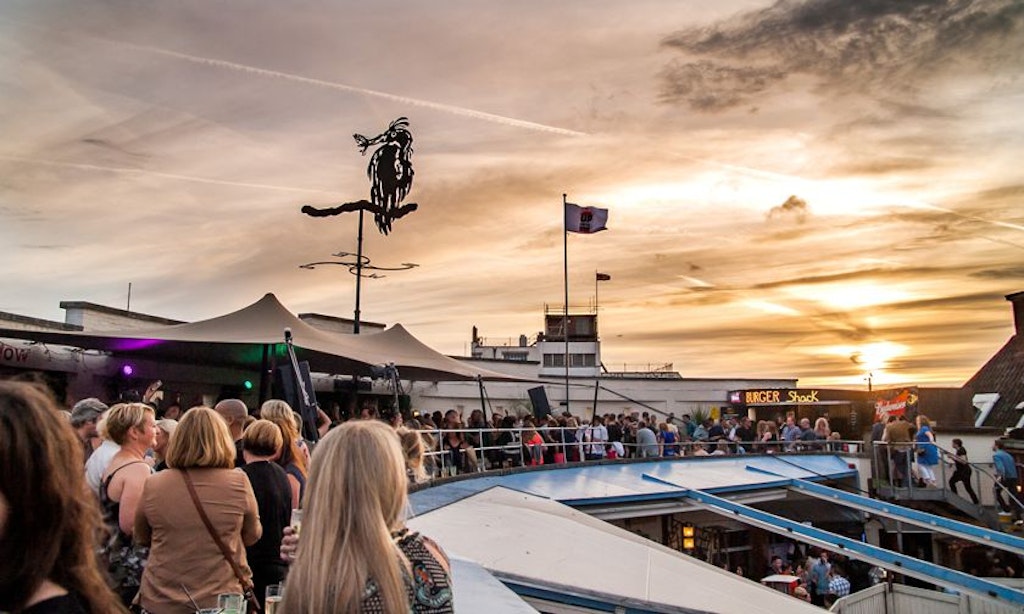 The Prince of Wales pub rooftop, with the sun setting in the background